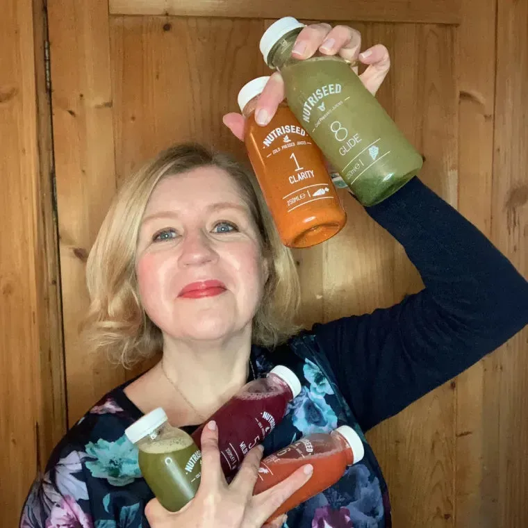 Joanne Mallon holding Nutriseed juices